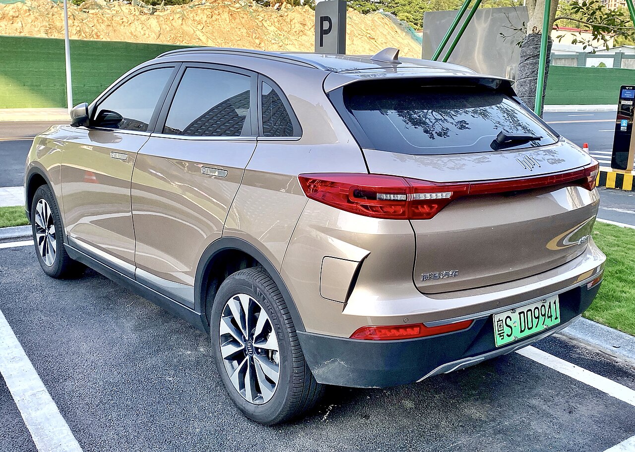 Beige Weltmeister EX5 reference vehicle photographed from the rear three-quarter angle
